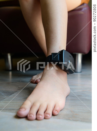 Prisoner is attached to an electronic monitoring on ankle Prisoner is attached to an electronic monitoring on ankle 90272808