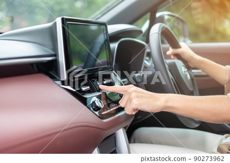 Finger presses the emergency stop button inside the car. Safety and transportation concept Finger presses the emergency stop button inside the car. Safety and transportation concept 90273962