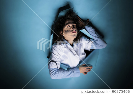 Crazy chemist with goofy appearance and messy hair after laboratory failed experiment on blue background. Mad silly scientist with wacky hairstyle and dirty face after dangerous chemical explosion. Crazy chemist with goofy appearance and messy hair after laboratory failed experiment on blue background. Mad silly scientist with wacky hairstyle and dirty face after dangerous chemical explosion. 90275406