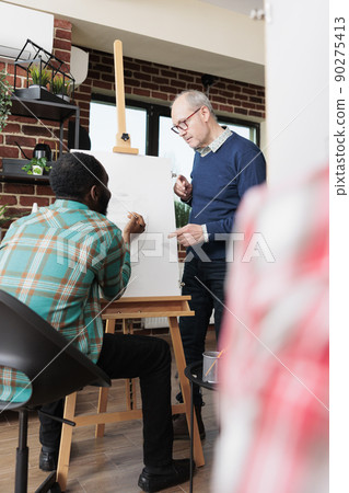 Art painter drawing graphic vase on canvas working at creativity illustration developing new artistic skills in creativity studio. Artist painter learning sketching technique creating modern artwork Art painter drawing graphic vase on canvas working at creativity illustration developing new artistic skills in creativity studio. Artist painter learning sketching technique creating modern artwork 90275413