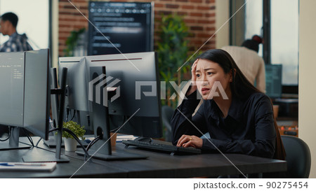 Cyber security programer focused on writing code encounters system failure while parsing algorithm sitting at desk. System engineer having unexpected compiling error while creating software. 90275454