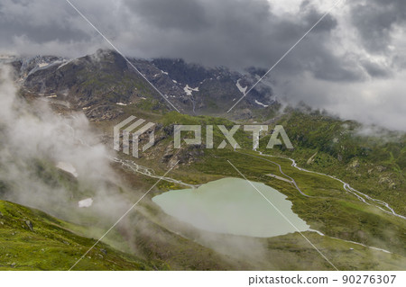 Typical alpine landscape of Swiss Alps with Steinsee, Urner Alps, Canton of Bern, Switzerland 90276307