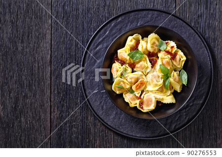 italian Tortelloni stuffed with sun dried tomatoes italian Tortelloni stuffed with sun dried tomatoes 90276553