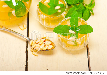 Arab traditional mint and pine nuts tea Arab traditional mint and pine nuts tea 90277337