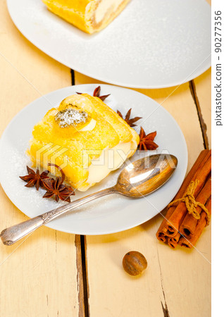 cream roll cake dessert and spices 90277356