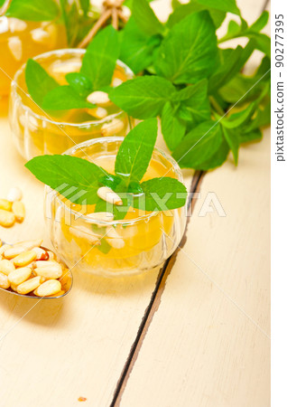 Arab traditional mint and pine nuts tea Arab traditional mint and pine nuts tea 90277395