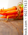 baby carrots bunch tied with rope 90277413