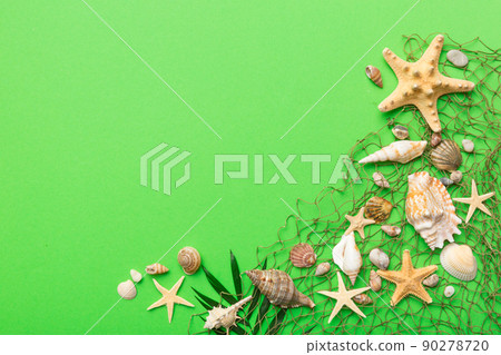 Summer time concept Flat lay composition with beautiful starfish and sea shells on colored table, top view with copy space for text Summer time concept Flat lay composition with beautiful starfish and sea shells on colored table, top view with copy space for text 90278720