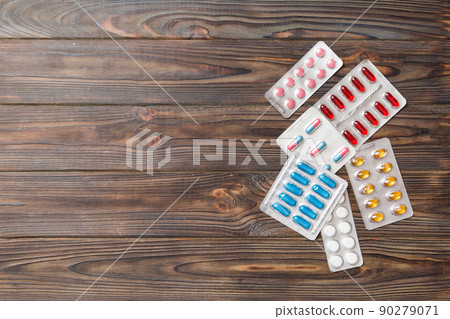 Protective face masks or surgical masks, medicine pills and thermometer on table background. Coronavirus disease. Corona virus concept. Space for text 90279071