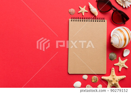Blank writing book with summer beach accessories on background, copy space. Flat lay with copy space Blank writing book with summer beach accessories on background, copy space. Flat lay with copy space 90279152