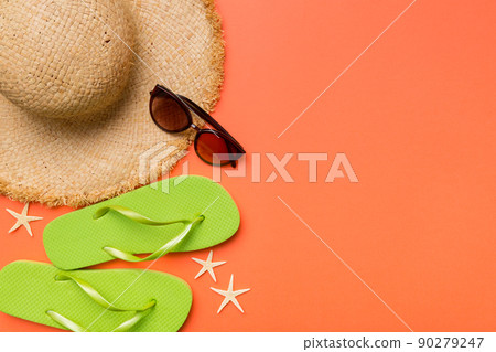Summer vacation concept flat lay. straw hat beach accessories and towel top view. Space for text. travel concept Summer vacation concept flat lay. straw hat beach accessories and towel top view. Space for text. travel concept 90279247