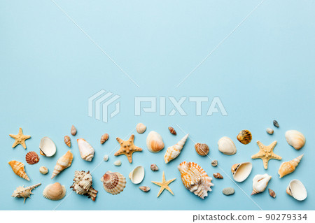 Summer time concept Flat lay composition with beautiful starfish and sea shells on colored table, top view with copy space for text Summer time concept Flat lay composition with beautiful starfish and sea shells on colored table, top view with copy space for text 90279334