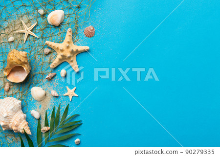 Summer time concept Flat lay composition with beautiful starfish and sea shells on colored table, top view with copy space for text Summer time concept Flat lay composition with beautiful starfish and sea shells on colored table, top view with copy space for text 90279335