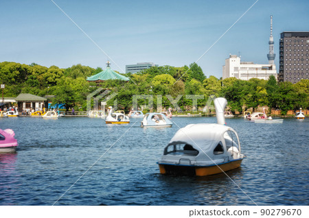 Scenery where you can see the swan boat floating in Shinobazu Pond in Ueno Onshi Park and Shinobazu Pond Benten-do Scenery where you can see the swan boat floating in Shinobazu Pond in Ueno Onshi Park and Shinobazu Pond Benten-do 90279670