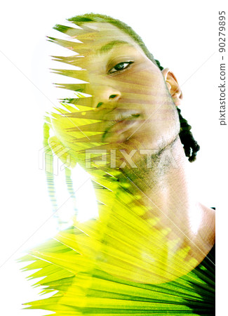 Double exposure portrait of a young man looking into the camera Double exposure portrait of a young man looking into the camera 90279895