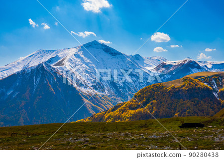 Mountain slopes and peaks in daytime Mountain slopes and peaks in daytime 90280438