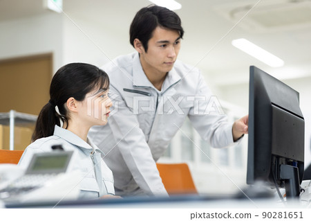 Men and women in work clothes working in the office 90281651