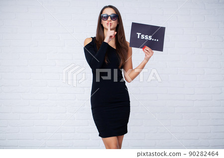 Sale and discounts concept, woman holding a poster with discounts Sale and discounts concept, woman holding a poster with discounts 90282464