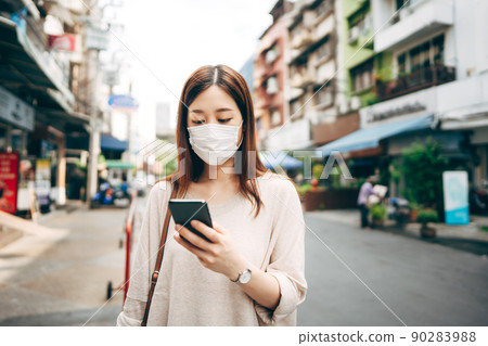 Business young asian single woman wear face mask for protective corona virus or covid 19 90283988