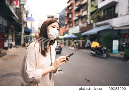 Business young asian single woman wear face mask for protective corona virus or covid 19 90283990