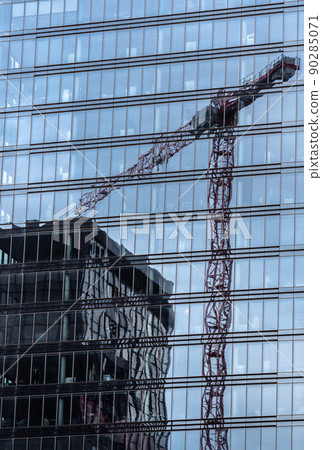 Schaerbeek, Brussels Capital Region - Belgium - Reflections of office buildings in plate glass at the administrative district 90285071