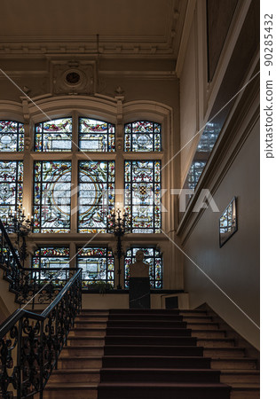 Anderlecht, Brussels Capital Region - Belgium - Decorated stained glass with inscriptions of ancient mayors of the municipality Anderlecht in the hall of the town hall Anderlecht, Brussels Capital Region - Belgium - Decorated stained glass with inscriptions of ancient mayors of the municipality Anderlecht in the hall of the town hall 90285432