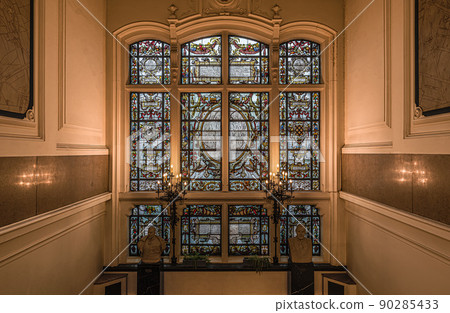 Anderlecht, Brussels Capital Region - Belgium -  Decorated stained glass with inscriptions of ancient mayors of the municipality Anderlecht in the hall of the town hall 90285433