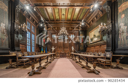 Anderlecht, Brussels Capital Region - Belgium -  View over the vintage council chamber with wooden decoration, chandeliers and stained glass 90285434