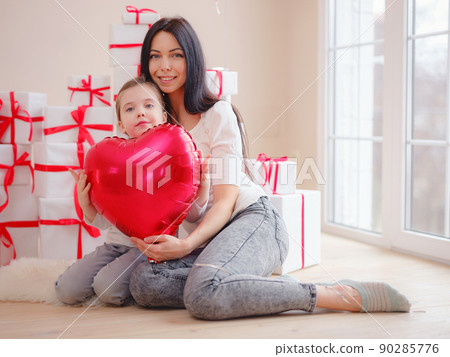 Loving mom hug little daughter express love Loving mom hug little daughter express love 90285776