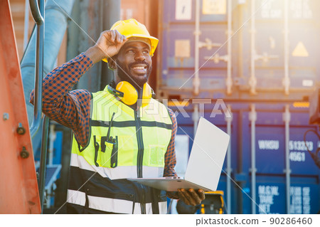 black worker African working engineer foreman in port cargo shipping with computer laptop black worker African working engineer foreman in port cargo shipping with computer laptop 90286460