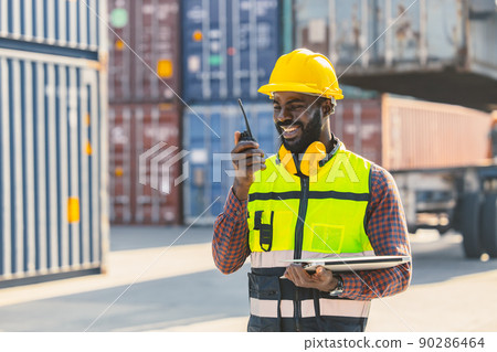 black worker African working engineer foreman radio control in port cargo shipping customs container yard black worker African working engineer foreman radio control in port cargo shipping customs container yard 90286464