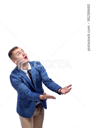 Portrait of attractive cheerful man catching copy empty space isolated over white background Portrait of attractive cheerful man catching copy empty space isolated over white background 90286660
