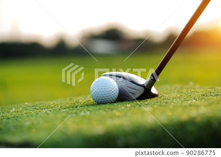 Golf balls on the golf course with golf clubs ready for golf in the first short. Golf balls on the golf course with golf clubs ready for golf in the first short. 90286775