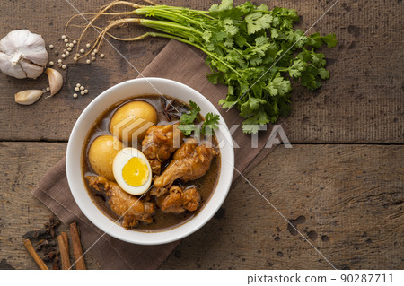 Egg and drummet chicken in Sweet Brown Sauce ,Kai Pa Lo in white bowl.Top view Egg and drummet chicken in Sweet Brown Sauce ,Kai Pa Lo in white bowl.Top view 90287711
