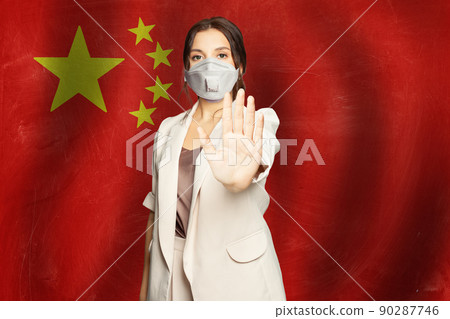 Confident woman in protective mask against flag of China banner background Confident woman in protective mask against flag of China banner background 90287746