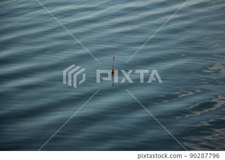 fishing on the river, fishing rod float on the surface of the water fishing on the river, fishing rod float on the surface of the water 90287796