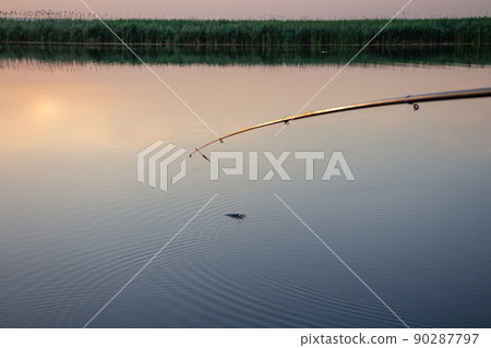 fishing on the river, fishing rod float on the surface of the water fishing on the river, fishing rod float on the surface of the water 90287797