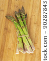Vegetarian fresh green asparagus. vegetable on wood 90287843