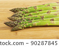 Vegetarian fresh green asparagus. vegetable on wood 90287845