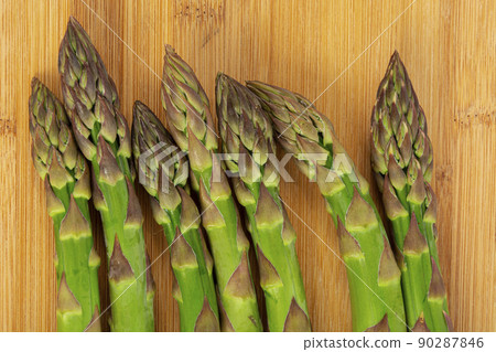 Vegetarian fresh green asparagus. vegetable on wood 90287846