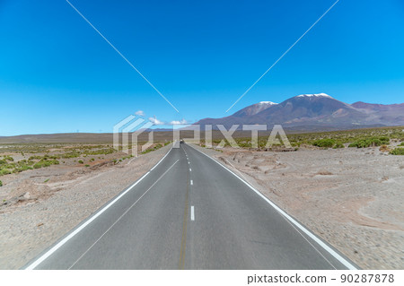 road in the mountains between the cliffs overlooking the snowy hills road in the mountains between the cliffs overlooking the snowy hills 90287878