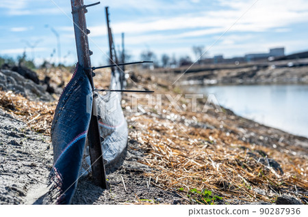 silt fence at a construction site with exposed dirt piled against the fabric silt fence at a construction site with exposed dirt piled against the fabric 90287936
