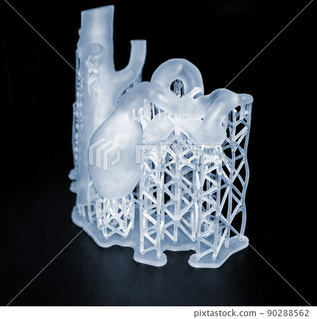 3D printed human heart prototype close-up. Object photopolymer printed on stereolithography 3D printer. Technology of liquid photopolymerization under UV light. New 3D printing technology for medicine 90288562