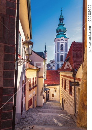 street of the old town - castle stairs and the tower of the Church of St. Jost, Cesky Krumlov, Czech republic 90288692