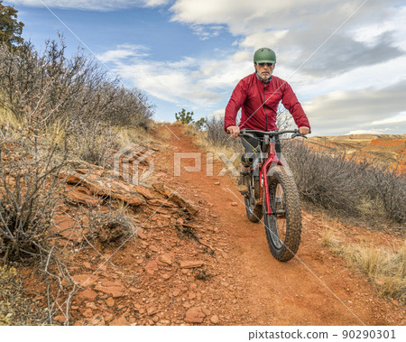 riding a fat mountain bike at Colorado foothills riding a fat mountain bike at Colorado foothills 90290301