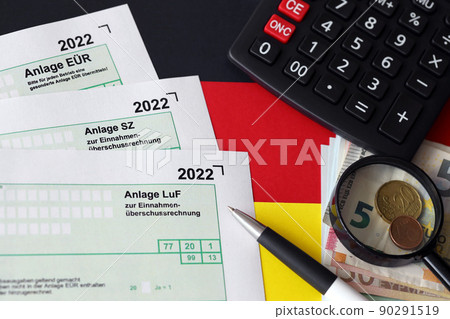 German different tax declaration blank forms - Anlage EUR, Anlage SZ and Anlage Luf. Documents lies with calculator, pen and european money 90291519