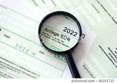 Anlage EUR - German 2022 Profit and Loss Statement and magnifying glass close up. The concept of taxation and accountant paperwork Germany Anlage EUR - German 2022 Profit and Loss Statement and magnifying glass close up. The concept of taxation and accountant paperwork Germany 90291715