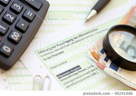 German statement on the assessment of retirement income with calculator and european money close up. The concept of taxation and accountant paperwork Germany 90291886