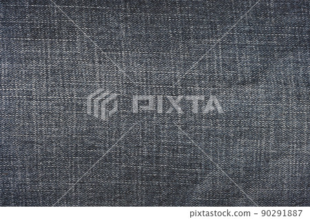 Detailed abstract texture of dark blue denim cloth. Background image of old used denim trousers fabric 90291887