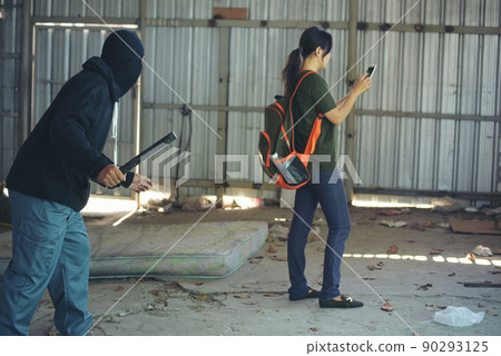 Thief armed man rob woman by baton on street stalker behind young woman back. Woman on phone careless stalker sneaking to steal, rob aggressive by danger bandit. Thief using baton nightstick weapon. Thief armed man rob woman by baton on street stalker behind young woman back. Woman on phone careless stalker sneaking to steal, rob aggressive by danger bandit. Thief using baton nightstick weapon. 90293125